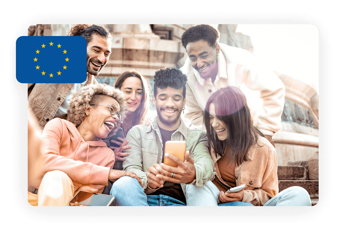 A group of diverse young adults sitting together, smiling and looking at a smartphone. The EU flag is displayed in the top left corner of the image.